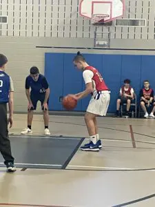 A boy playing basketball. 