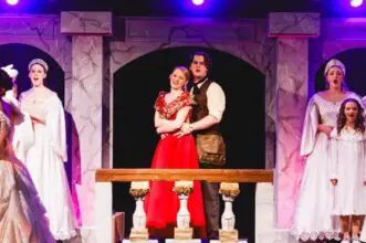 Actors from Cavod Theatre performing the musical "Anastasia" on stage.